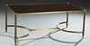 Maison Jansen Style Mid Century Modern Brass Plated Iron and Mahogany Coffee Table, 20th c., the rectangular top within a brass plated frame, on reede