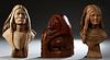 Group of Three Carved Wooden Native American Heads, 20th c., consisting of a matching man and woman on tapered square plinths, and a male bust over a 