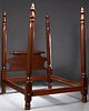 American Carved Mahogany Four Poster Bed, 19th c., the rolling pin headboard flanked by two acorn finialed turned posts, to wood rails and like posts 