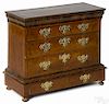 Miniature George II walnut veneer chest on frame, early 18th c., with a geometric line inlaid top