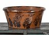 Pennsylvania redware mixing bowl, 19th c., with manganese splotch decoration, 4 3/8'' h., 10'' dia.