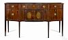 Federal mahogany sideboard, ca. 1800, with large griffin inlaid oval cartouches