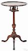 Federal cherry candlestand, ca. 1800, with birdcage and urn turned standard, 29'' h., 17 1/2'' w.