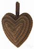 Tramp art carved heart-shaped wall pocket, ca. 1900, 7'' h., 5'' w.