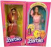 (2) Beautiful Barbies including Kissing Barbie & India Barbie. They are in their original boxes and considered MIB. The boxes has a few light damages.