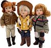 Lot of 3 Kish & Co hard vinyl, painted face dolls @ approx 8" tall. Dolls have outdoor themes such as equestrian and cowgirl, w/pistol as an accessory