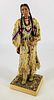 A Marcia Ahren artist doll, circa 1993, #144, depicting a Blackfoot woman. From series of dolls in historical costumes. Figure stands 12" tall in leat