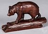 Carved bear, early 20th, crossing a log