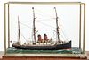 Early steamship model with glass case