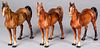 Three painted cast iron horses