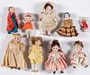 Nine small bisque dolls
