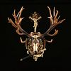 A KAISER WILHELM II THIRTY-TWO POINT RED STAG TROPHY MOUNT WITH ST. HUBERTUS CRUCIFIX, 1889,