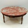 19/20th Century carved painted parcel gilt wood coffee table with marble top. Unsigned. Rubbing, wear and surface losses. Measures 17" H x 40-1/2" dia