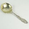 Large Gorham Art Nouveau Design Serving Spoon. Light gold wash on bowl. Signed Gorham Sterling H158. Good condition. Measures 10" and weighs approx. 5