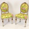 Pair of 19th Century Italian carved and painted side chairs. Unsigned. Rubbing, surface wear, consistent with use and age. Measures 38" H x 20" W x 16