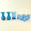 Lot of Nine (9) Blue Opaline Glass Tabletop Items. Includes 2 bulbous vases, an enameled vase and 6 enameled glasses. Unsigned. Good condition. The en