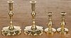 Two pairs of reproduction brass taperstick holders, 3'' h. and 4 1/2'' h.