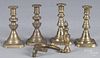Two pairs of brass tapersticks, ca. 1900, together with a tieback with an urn finial