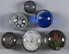 Six glass paperweights, to include millefiori, floral, and one studio example, signed GR 07