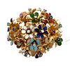 18 Karat Gold Brooch, having enameled flowers of various colors, with diamonds, emeralds and sapphires, with appraisal, height 1 inch, width 1 1/4 inc