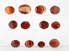 Grp: 12 Red Agate Snuff Boxes