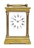 * A French Brass and Glass Carriage Clock Height over handle 8 inches.