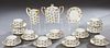 Twenty-Five Piece French Limoges Porcelain Coffee Set, 20th c., by B-D, consisting of 11 cups, 12 saucers, a cream pitcher and a covered sugar bowl. S
