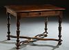 French Provincial Henri II Style Writing Table, late 19th c., the sloping edge rectangular top over a single frieze drawer on turned tapered reeded le