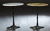 Pair of French Cast Iron Marble Top Bistro Tables, the circular top on a reeded knopped support to tripodal paw feet, one with a white marble, one wit