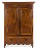 * A Louis XV Provincial Walnut Armoire Height 88 x width 60 1/4 x depth 19 inches.