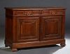 French Provincial Louis Philippe Carved Walnut Sideboard, late 19th c., the stepped edge rectangular top over two fielded panel frieze drawers, above 