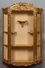 French Louis XVI Style Giltwood Hanging Wall Display Cabinet, 20th c., the arched pierced bow form crest over a central wide beveled glass door, flank