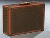 Vintage Louis Vuitton Small Hard Suitcase, with leather Louis Vuitton luggage tag, H.- 16 1/2 in., W.- 24 in., D.- 8 1/2 in.