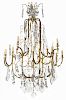 A French Brass and Cut Glass Twenty-Four-Light Chandelier Height 56 x diameter 37 inches.