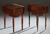 Two French Louis Philippe Carved Walnut Drop Leaf Work Tables, 19th c.,one with two drawers on one end, and a sliding work bin, over a fall front cupb