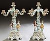 Pair of Meissen Style Polychromed and Gilt Decorated Five Light Figural Candelabra, 20th c., with a central candle arm over four scrolled floral mount