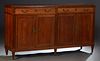 French Louis XVI Style Carved Cherry Sideboard, 20th c., the banded rectangular top over two large frieze drawers, above four cupboard doors flanked b