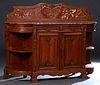 French Louis XV Style Carved Walnut Marble Top Sideboard, 19th c., with an arched figured rouge marble back splash, over a highly figured rouge breakf