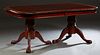 Inlaid and Banded Carved Mahogany Dining Table, 20th c., with a gadrooned edge, on double urn form pedestals on tripodal paw feet, with two leaves, H.