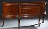 Chippendale Style Carved Mahogany Bowfront Sideboard, 20th c., the stepped serpentine top over a bank of two convex drawers, flanked by fielded panel 
