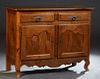 French Provincial Louis XV Style Carved Cherry Sideboard, 19th c., the rounded corner and edge top over two frieze drawers above double cupboard doors