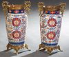 Pair of Large Gilt Bronze Mounted Imari Baluster Porcelain Vases, 20th c., with gilt bronze dragon handles, over sides with painted butterfly and clou