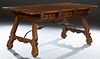 Spanish Renaissance Style Carved Beech Dining Table, c. 1900, the stepped rounded corner rectangular top on pierced trestle bases, joined by wrought i