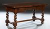 French Provincial Louis XIII Style Carved Oak Writing Table, 19th c., the thick rounded corner top on large rope twist legs joined by a rectangular st