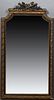 French Louis XVI Style Gilt and Gesso Overmantel Mirror, late 19th c., with a pierced torch and quiver crest over a shaped frame with relief ribbons a