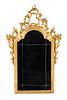 An Italian Baroque Style Giltwood Mirror Height 46 inches.
