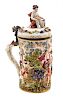 * A Capo-di-Monte Gilt Metal Mounted Porcelain Tankard Height 12 inches.