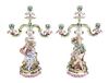 A Pair of Continental Porcelain Three-Light Figural Candelabra Width of candelabra arms 11 1/2 inches.