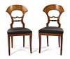 * A Pair of Biedermeier Birch and Ebonized Side Chairs Height 37 x width 18 1/4 x depth 16 1/4 inches.