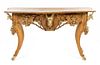 A Black Forest Style Parcel Gilt Fruitwood Console Table